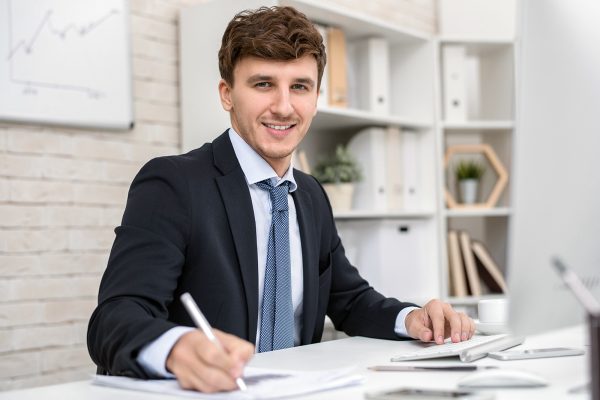 successful-entrepreneur-posing-at-desk-DTVHMGU.jpg